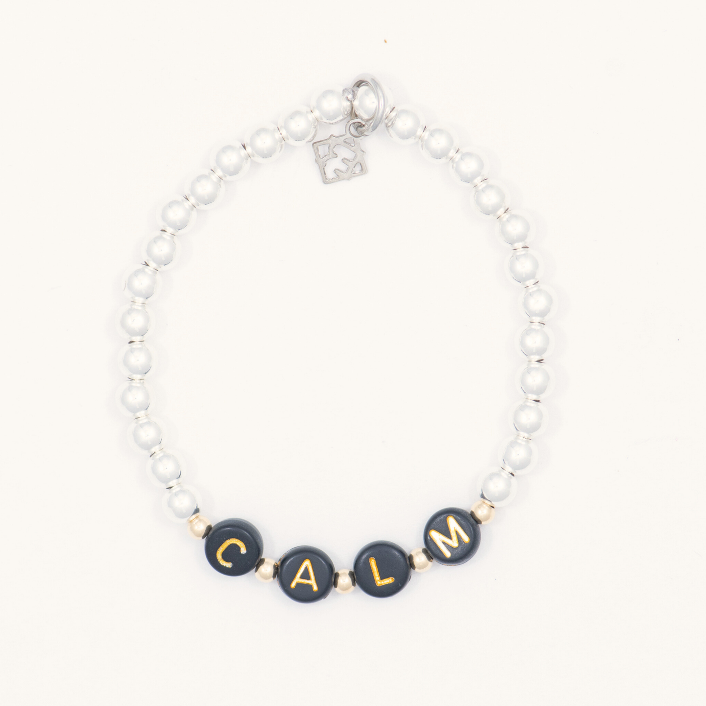 Bracelet with 'CALM' beads on a white background