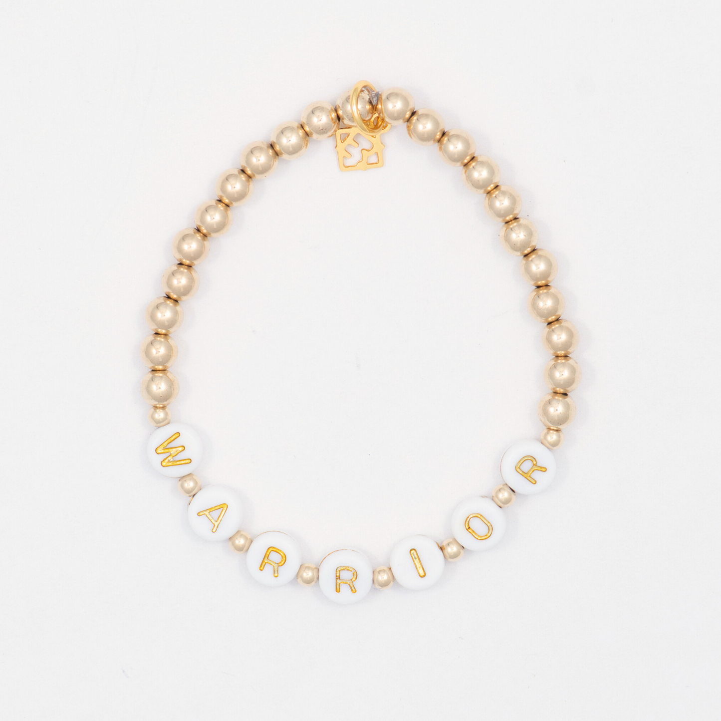Bracelet with gold and white beads spelling 'WARRIOR' on a light background
