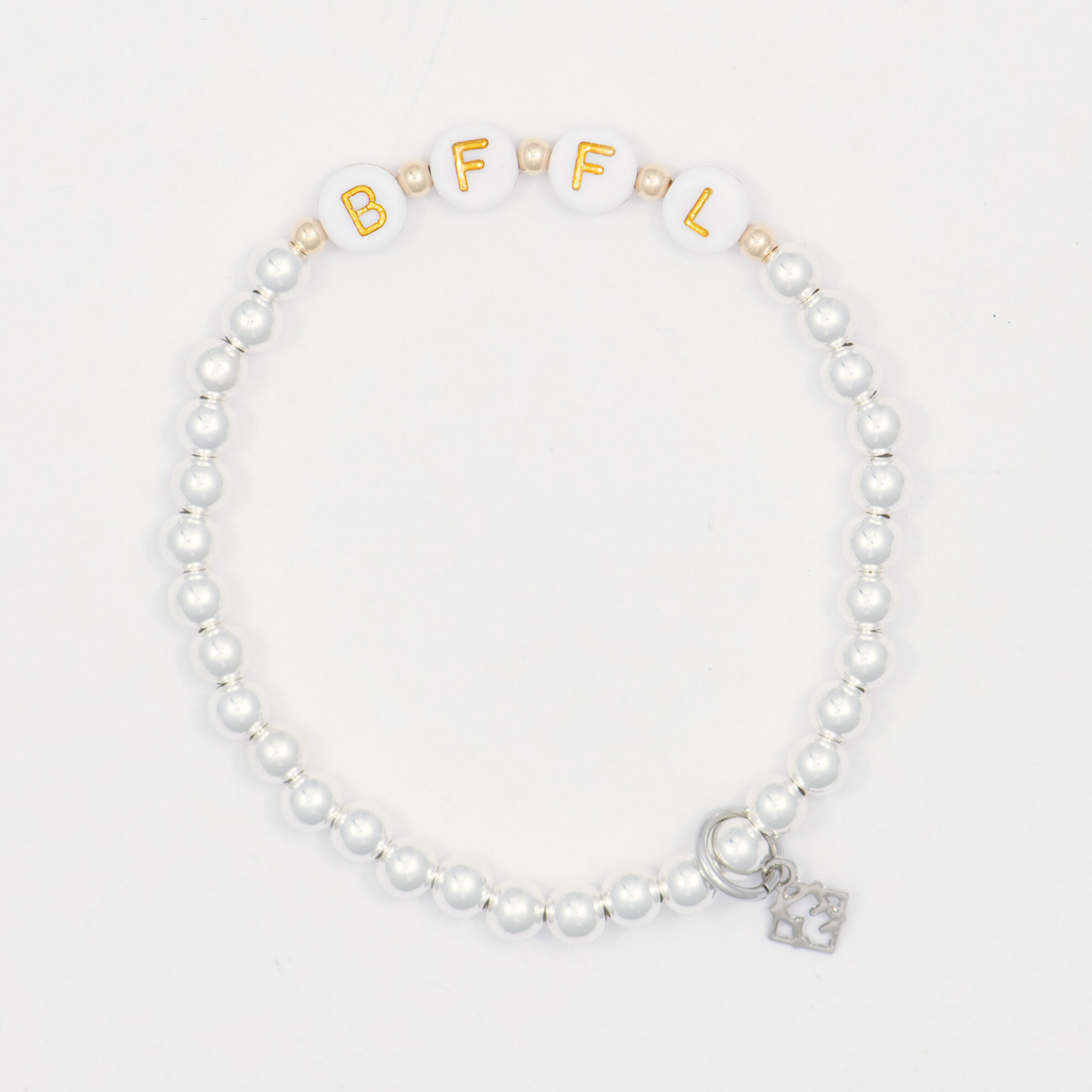 Beaded bracelet with gold letter beads and a silver charm on a white background