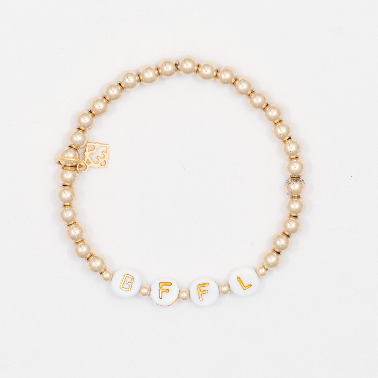 Beaded bracelet with 'BFFL' beads on a white background