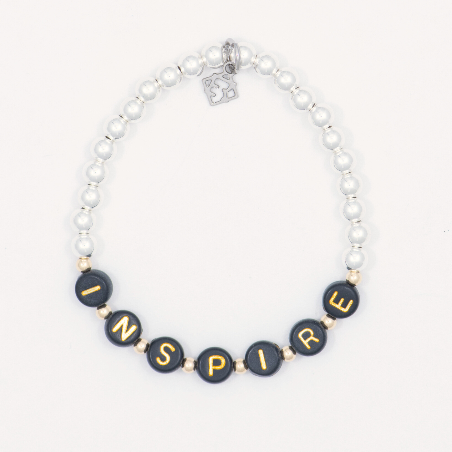 Bracelet with black beads spelling 'INSPIRE' on a white background