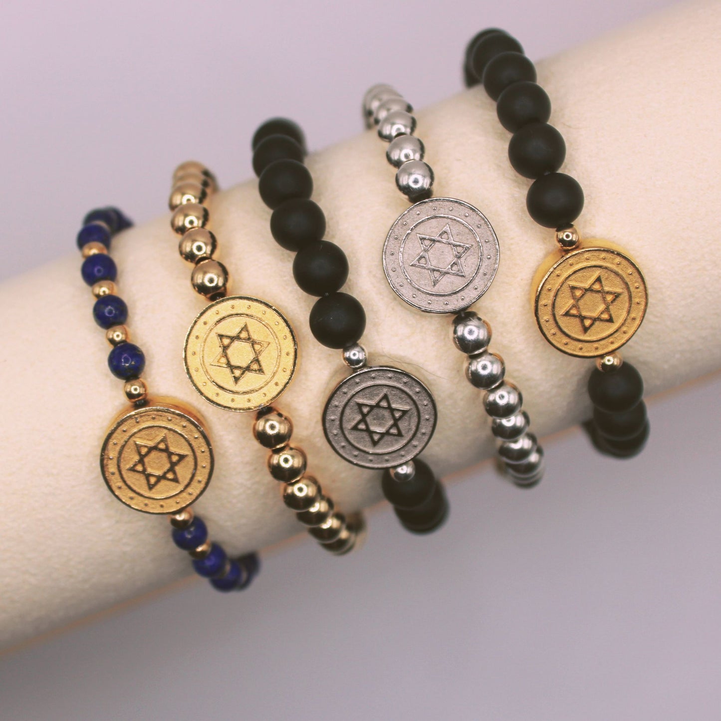4 bracelets with the Star of David on them