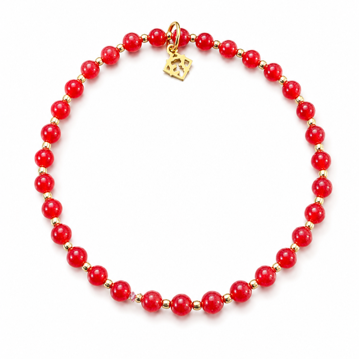 A red beaded necklace with small gold spacer beads and a gold clasp, displayed on a clean white background.