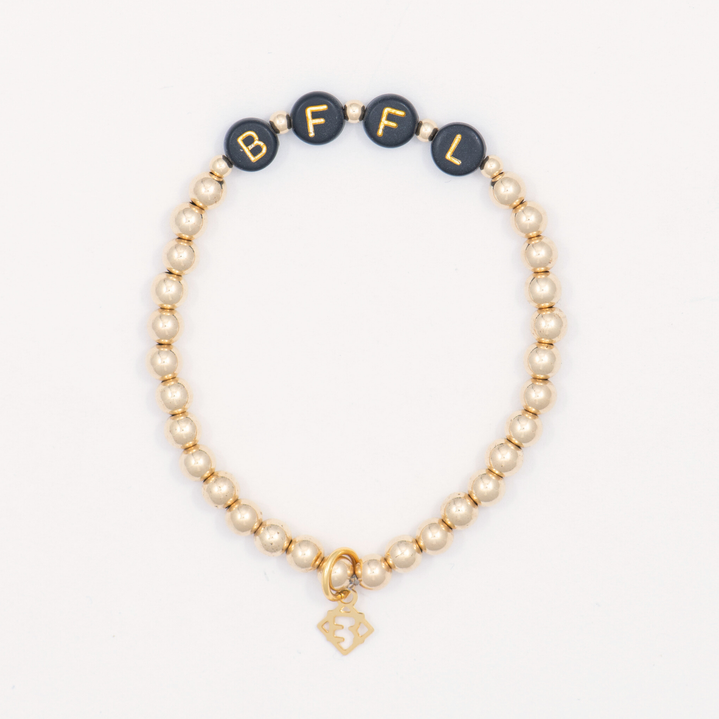Beaded bracelet with black beads labeled 'BFFL' on a white background