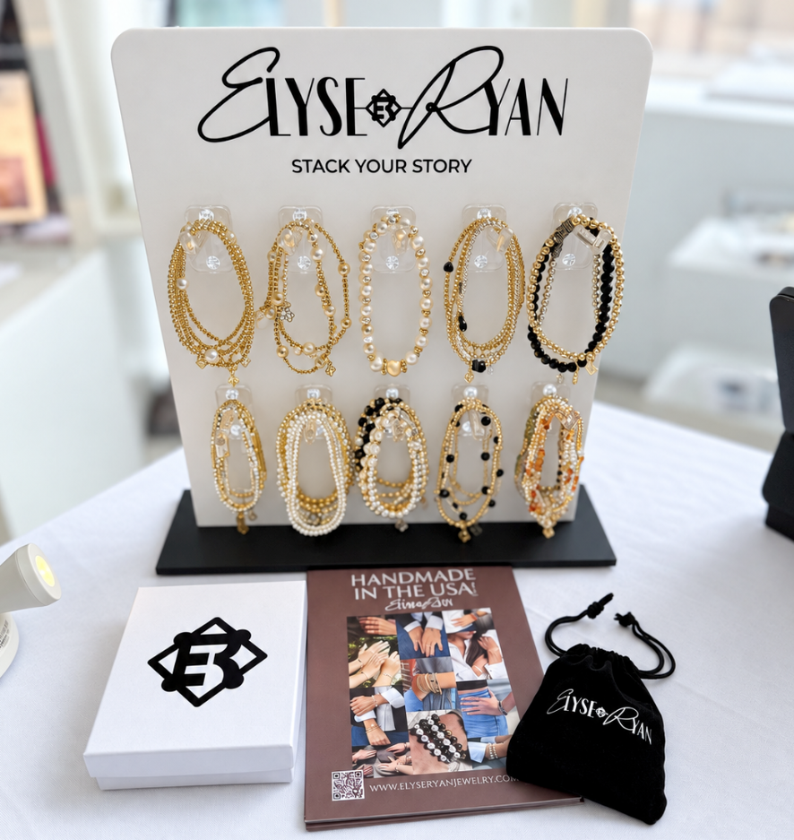 ElyseRyan Jewelry wholesale display featuring handcrafted bracelets, retail packaging and branded merchandising materials.