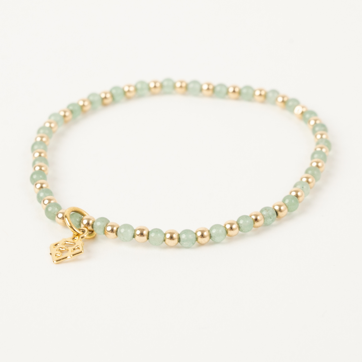 Green aventurine stretch bracelet with alternating 14K gold-filled beads and an ElyseRyan charm