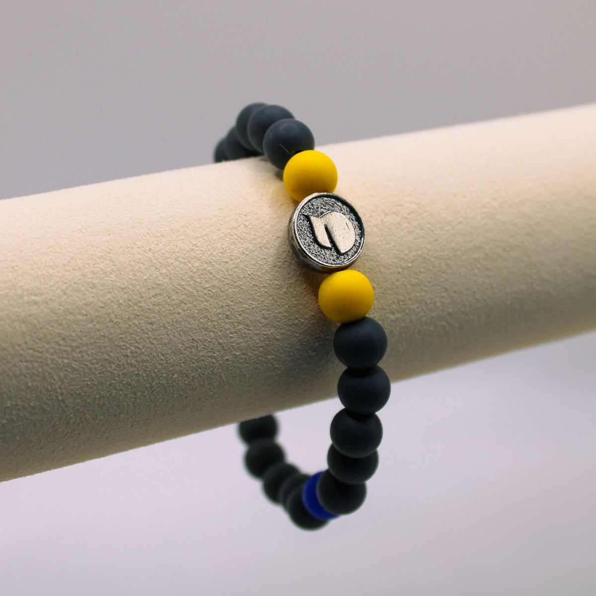 CT Cancer Foundation WIN bracelet with black and yellow silicone beads and a pewter baseball hat bead