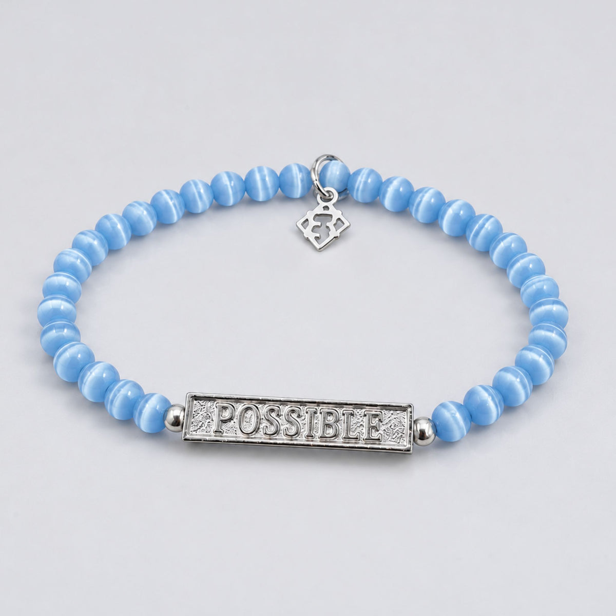 Autism Speaks bracelet with blue beads, silver accents and an engraved POSSIBLE bar