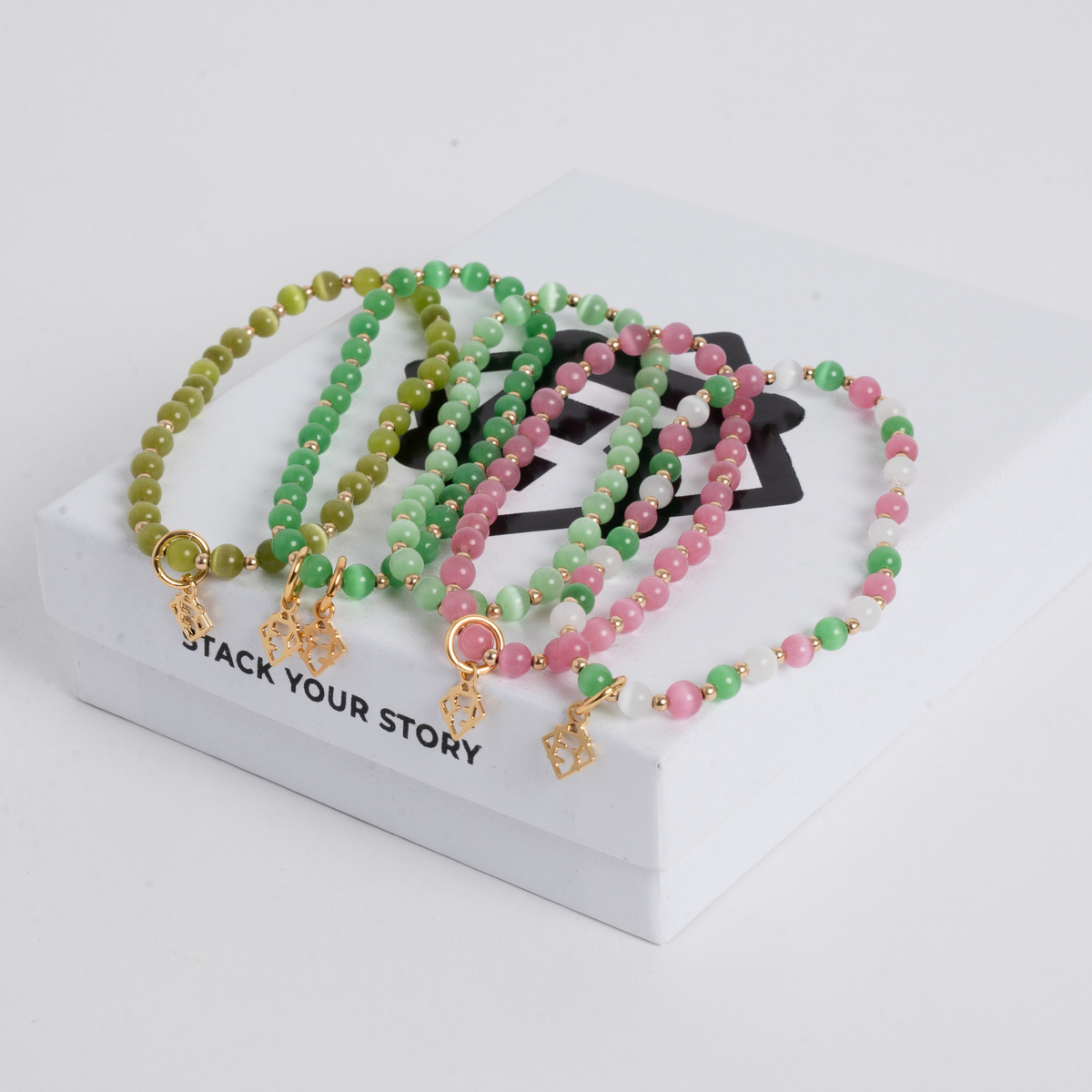 Green Prism Bracelet Stack with five colorful cat’s-eye bracelets and 14K gold-filled accents