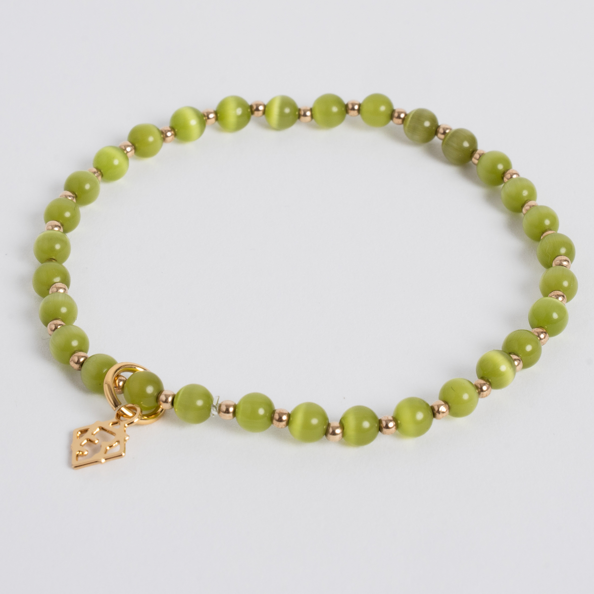 Lime Green Prism Bracelet with 4mm cat’s-eye stones, 14K gold-filled beads and a golden ER charm