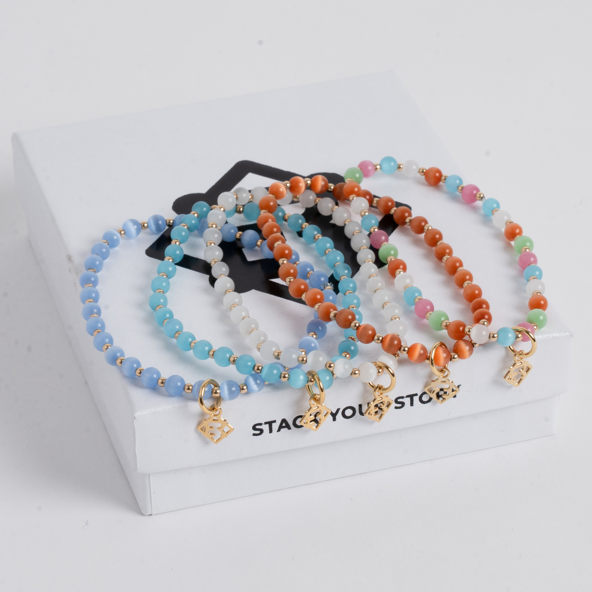 Prism Multi Bracelet Stack with five colorful cat’s-eye bracelets and 14K gold-filled accents