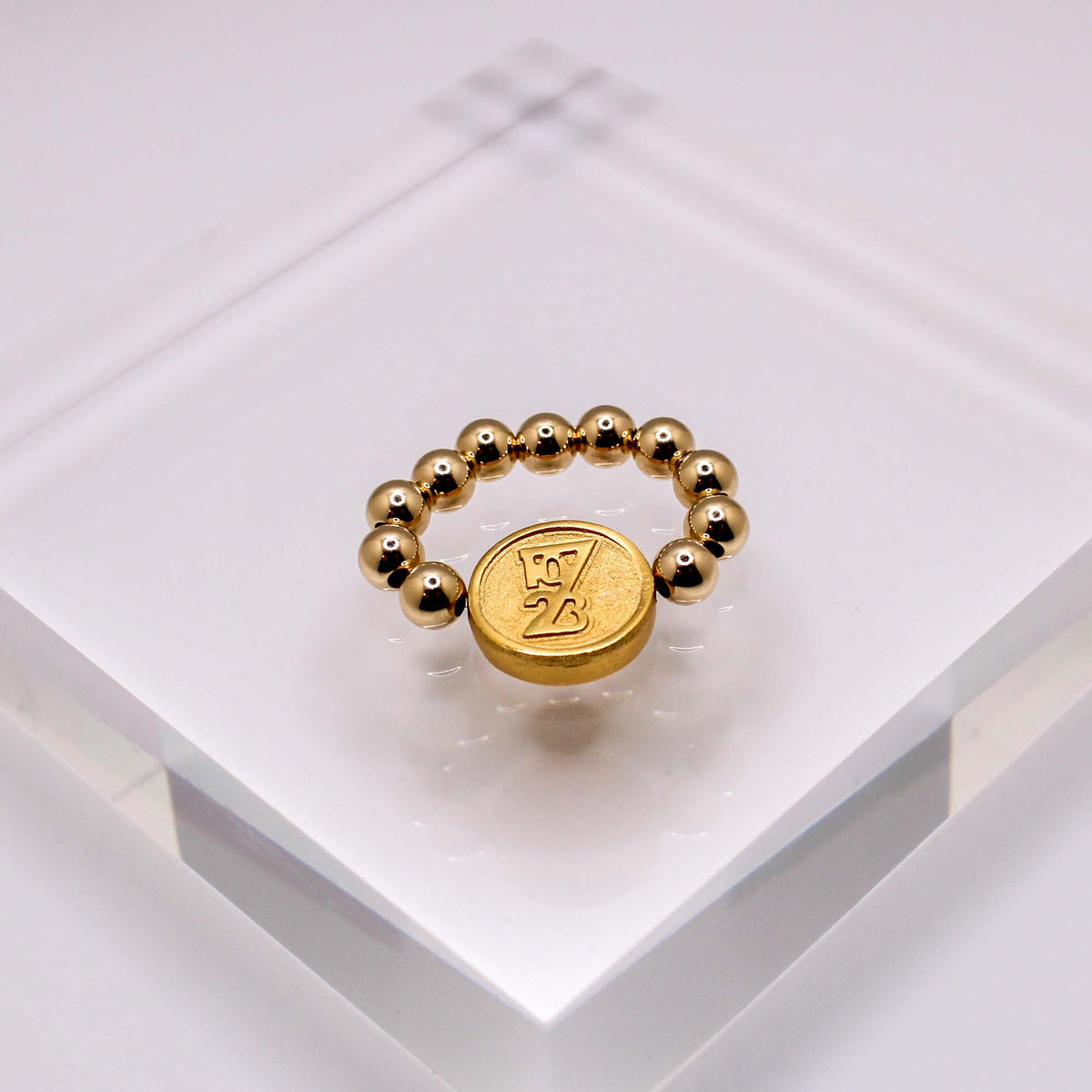 Forever stretch ring with 5mm 14K gold-filled beads and a gold October 7, 2023 remembrance design