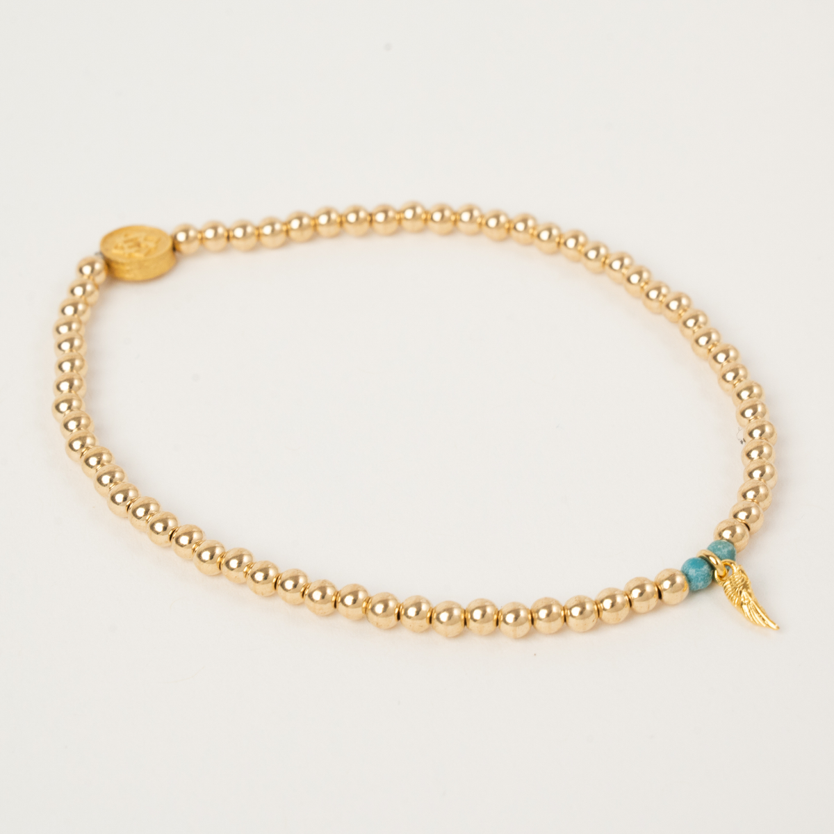 Haven Turquoise memorial bracelet with 3mm 14K gold-filled beads, turquoise accents and a golden angel wing